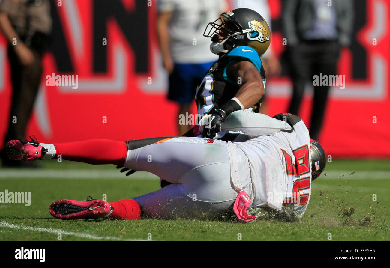 Oct. 11, 2015 - Tampa, Florida, U.S. - DIRK SHADD   |   Times  .Tampa Bay Buccaneers defensive end George Johnson (94) tackles Jacksonville Jaguars running back Corey Grant (33) and causes a fumble recovered by Buccaneers defensive end Jacquies Smith (56) who takes it three yards for a touchdown during second half action at Raymond James Stadium Sunday afternoon in Tampa (10/11/15) (Credit Image: © Dirk Shadd/Tampa Bay Times via ZUMA Wire) Stock Photo