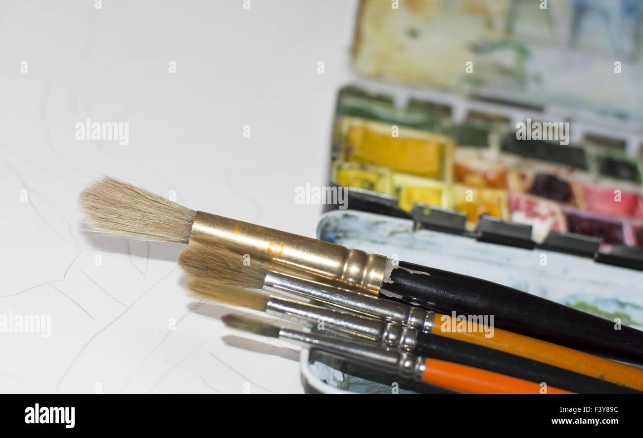 Watercolor brushes and paint box Stock Photo