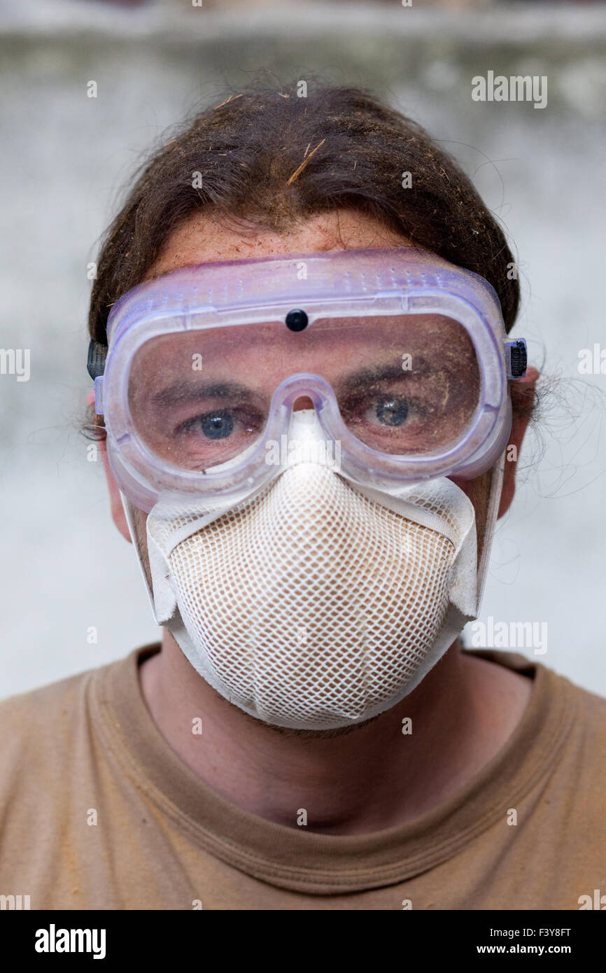 Worker with breathing mask Stock Photo