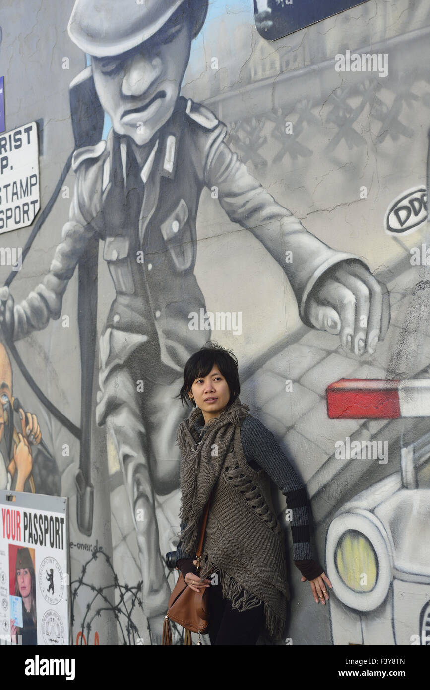 Asian tourist at Berlin´s Eastside Gallery Stock Photo