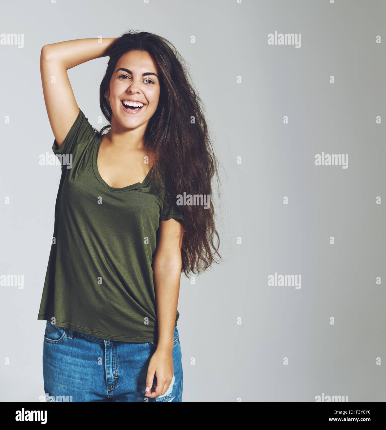 Brunette woman smiling and laughing at the camera. Isolated portrait. Casual trendy dressed Stock Photo