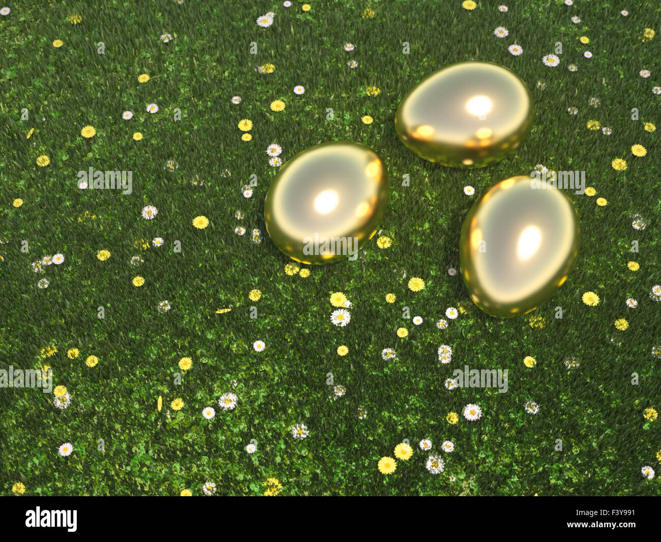 Golden Eggs lying in green meadow Stock Photo