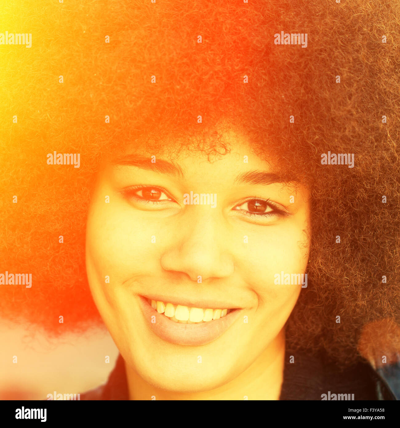 Portrait of a young afro girl in the sun Stock Photo