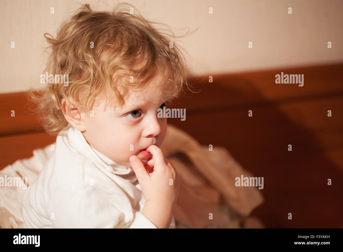 Adorable thoughtful little child Stock Photo