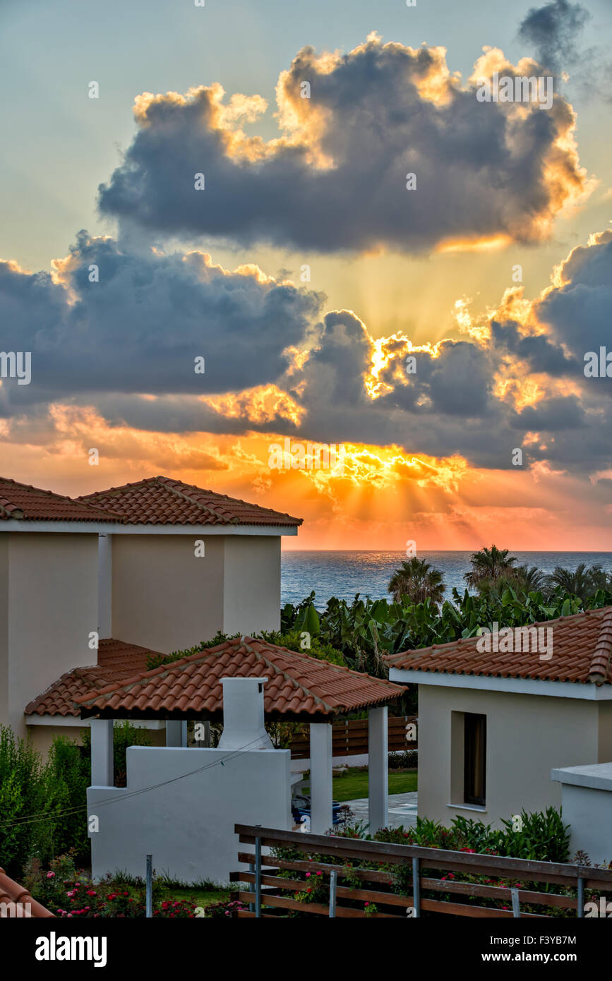 Sunset over holiday beach villas Stock Photo