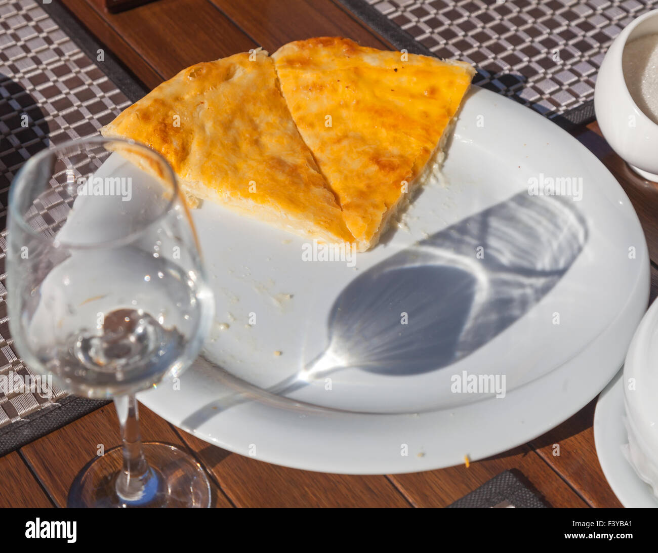 Imeretian khachapuri on white dish Stock Photo