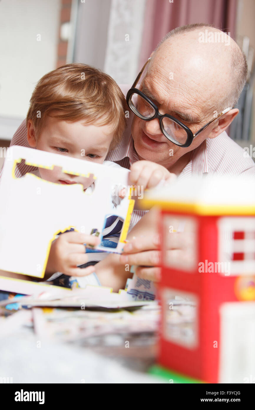 Grandpa and his grandson playing Stock Photo
