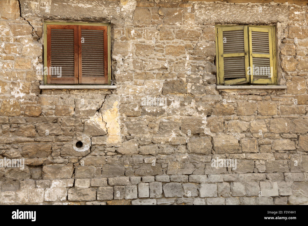 Old locked windows in vintage wall Stock Photo Alamy