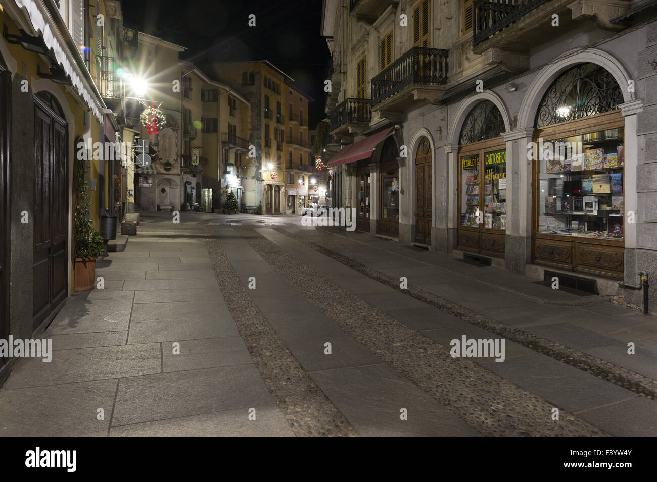 A nighttime street scene, Varallo Stock Photo