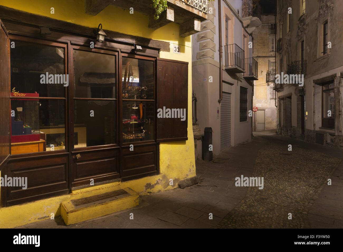 A nighttime street scene, Varallo Stock Photo