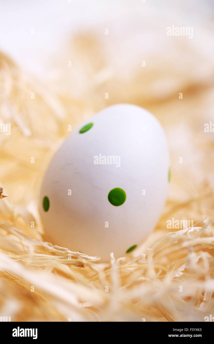 white easter egg with green spots Stock Photo Alamy