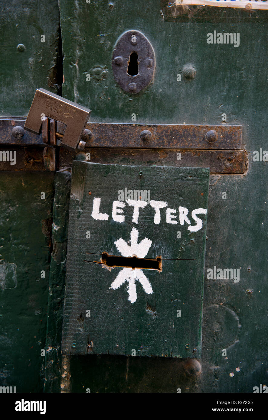 Temporary letterbox on ancient padlocked door Valletta Malta Stock Photo