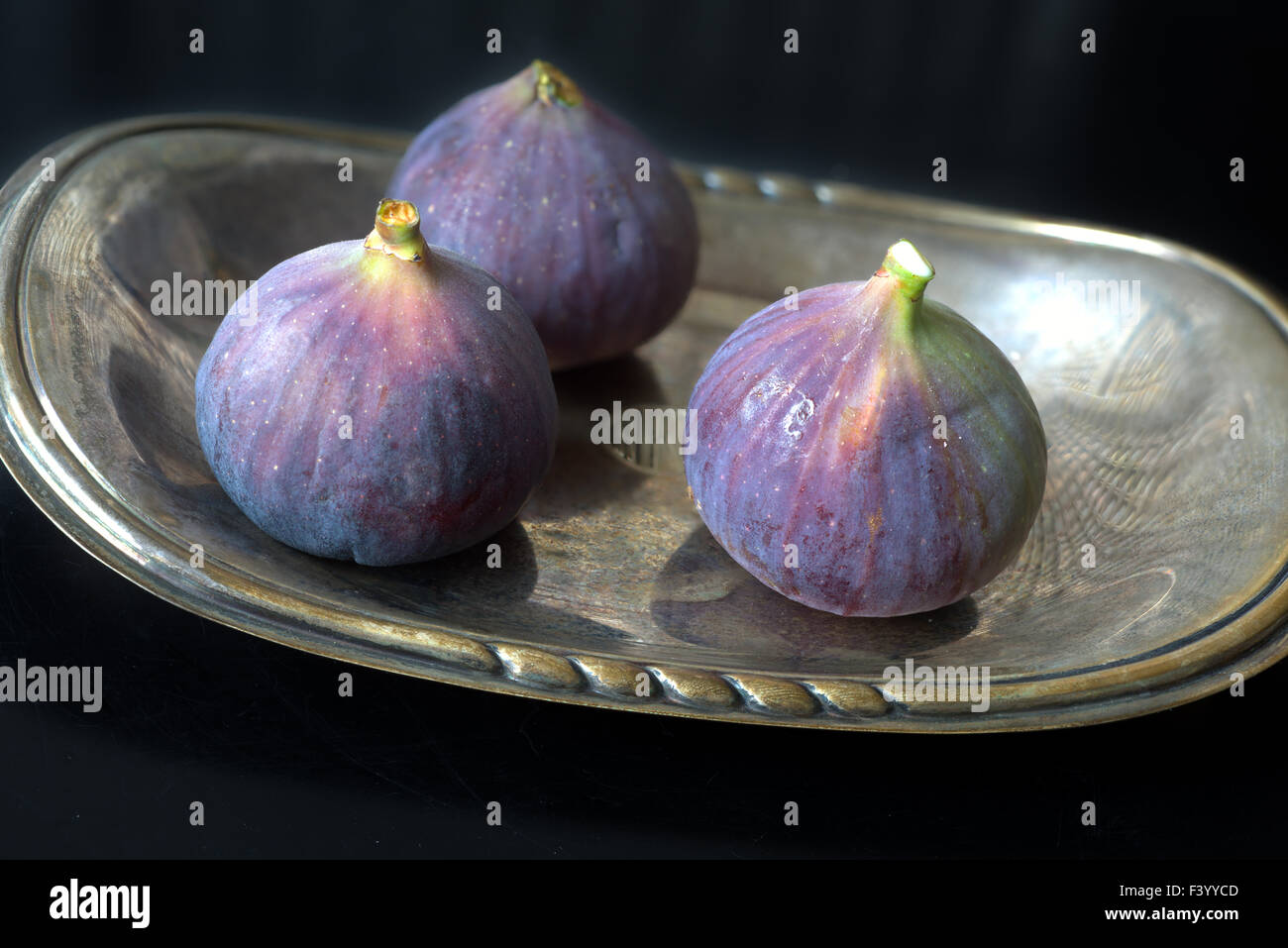 Figs in a silverplate Stock Photo