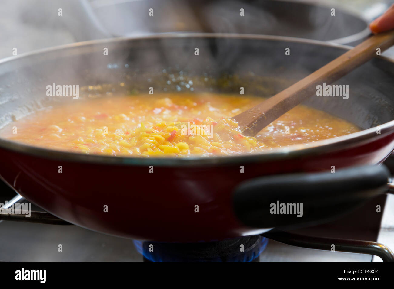 Rice being cooked Stock Photo - Alamy