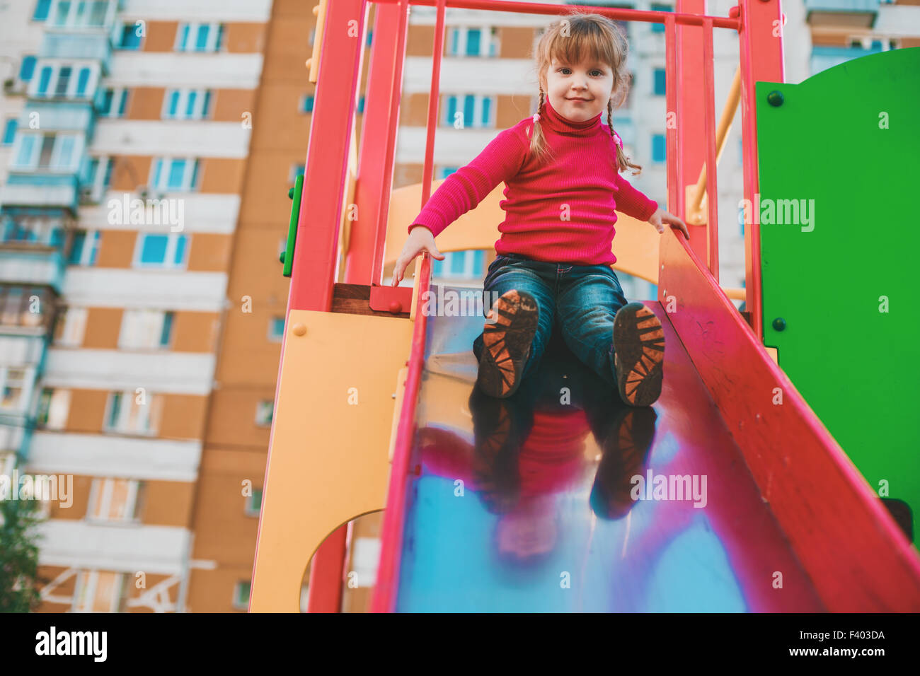 Little girl on the playground Stock Photo - Alamy