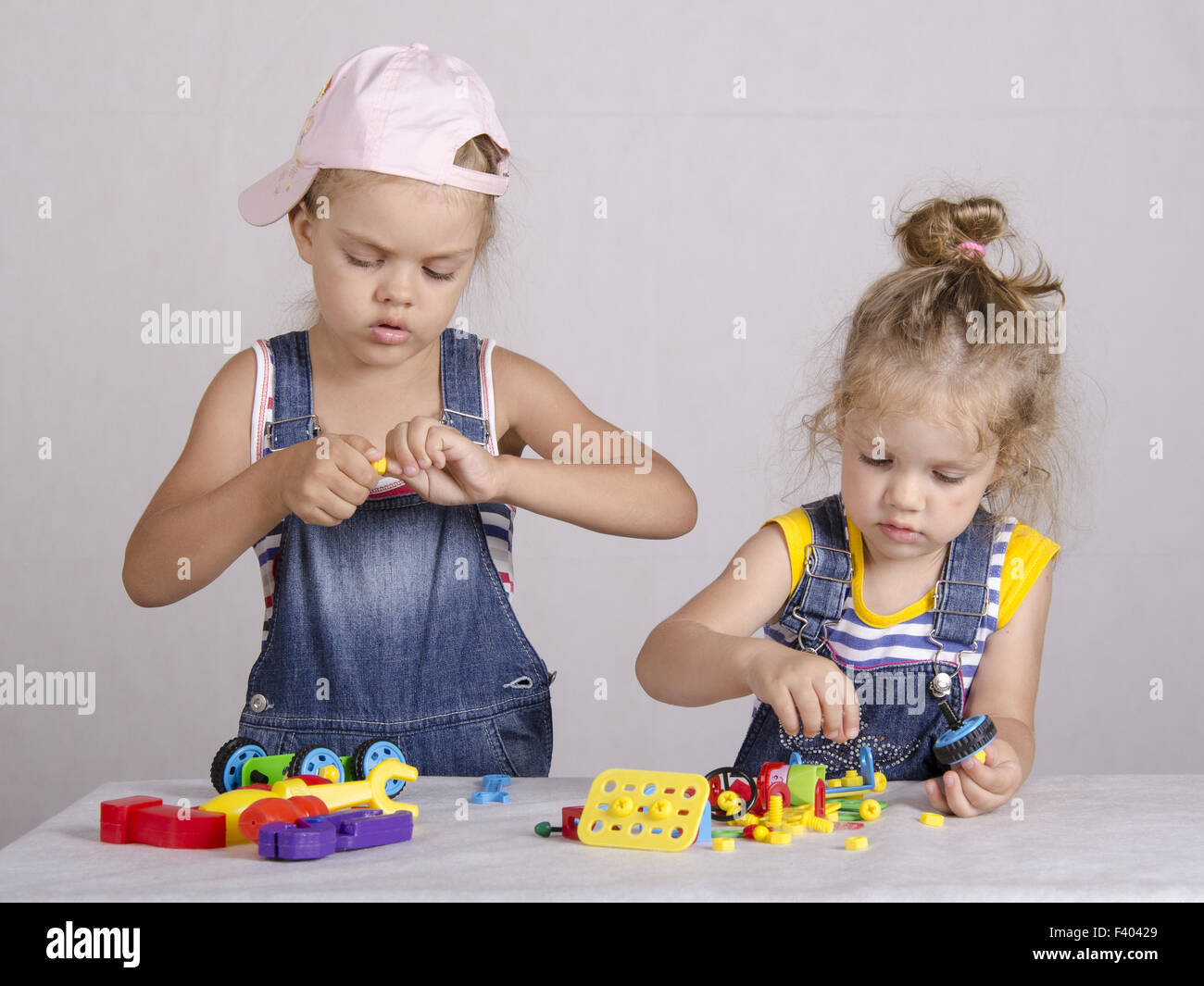Two children play in the constructor Stock Photo