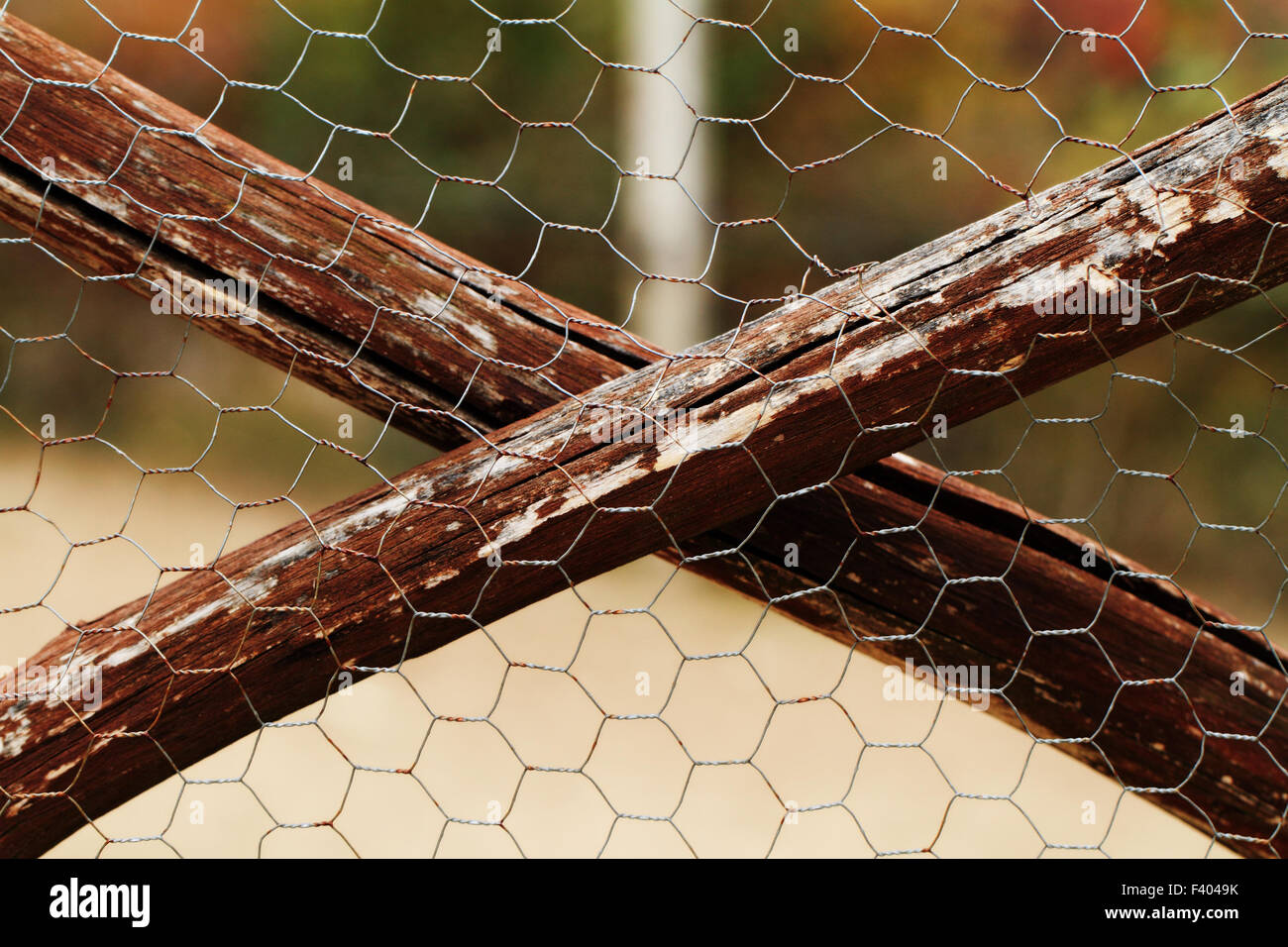 Brown painted wood and thin wire fence Stock Photo