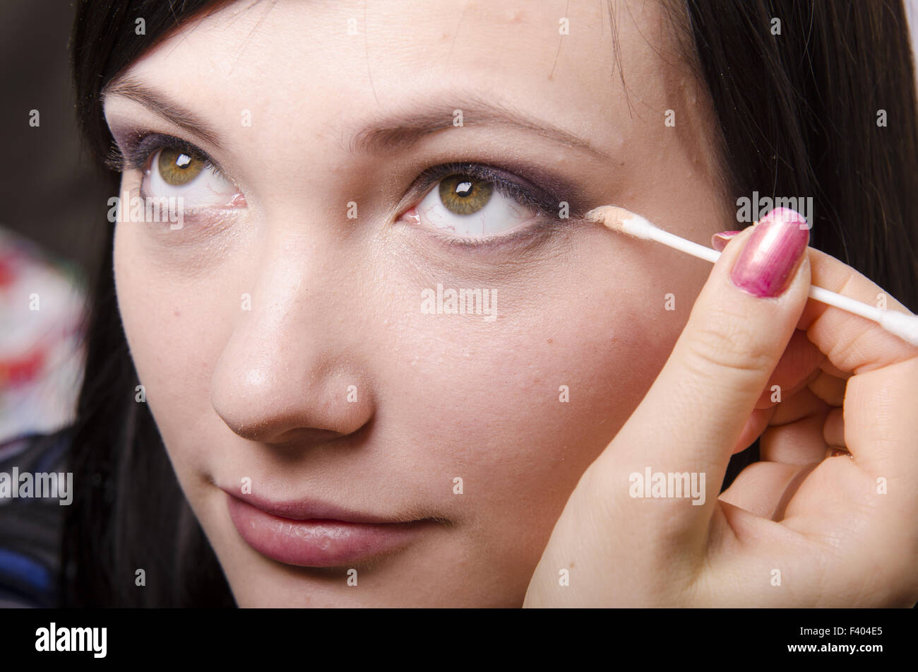 Makeup artist colors upper eyelids model Stock Photo Alamy