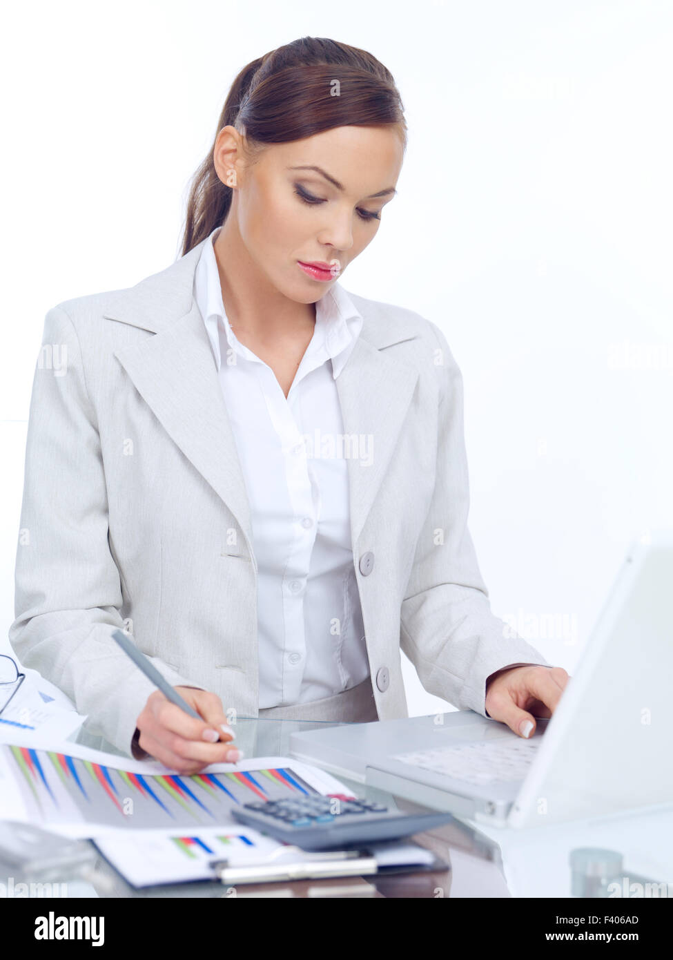 Elegant Businesswoman Working At Her Desk Stock Photo 88515461
