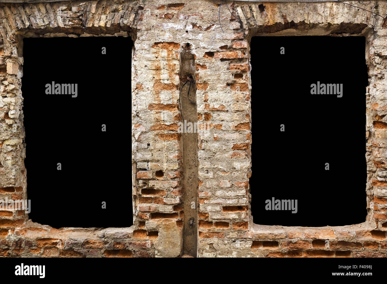 Black zones in brick wall Stock Photo