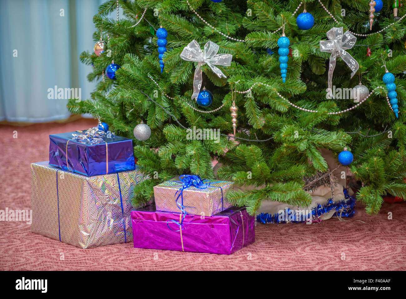 Gifts under christmas tree Stock Photo