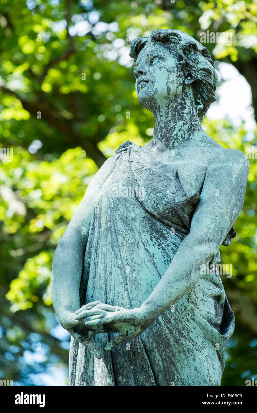 Female Statue Looking Uo Stock Photo
