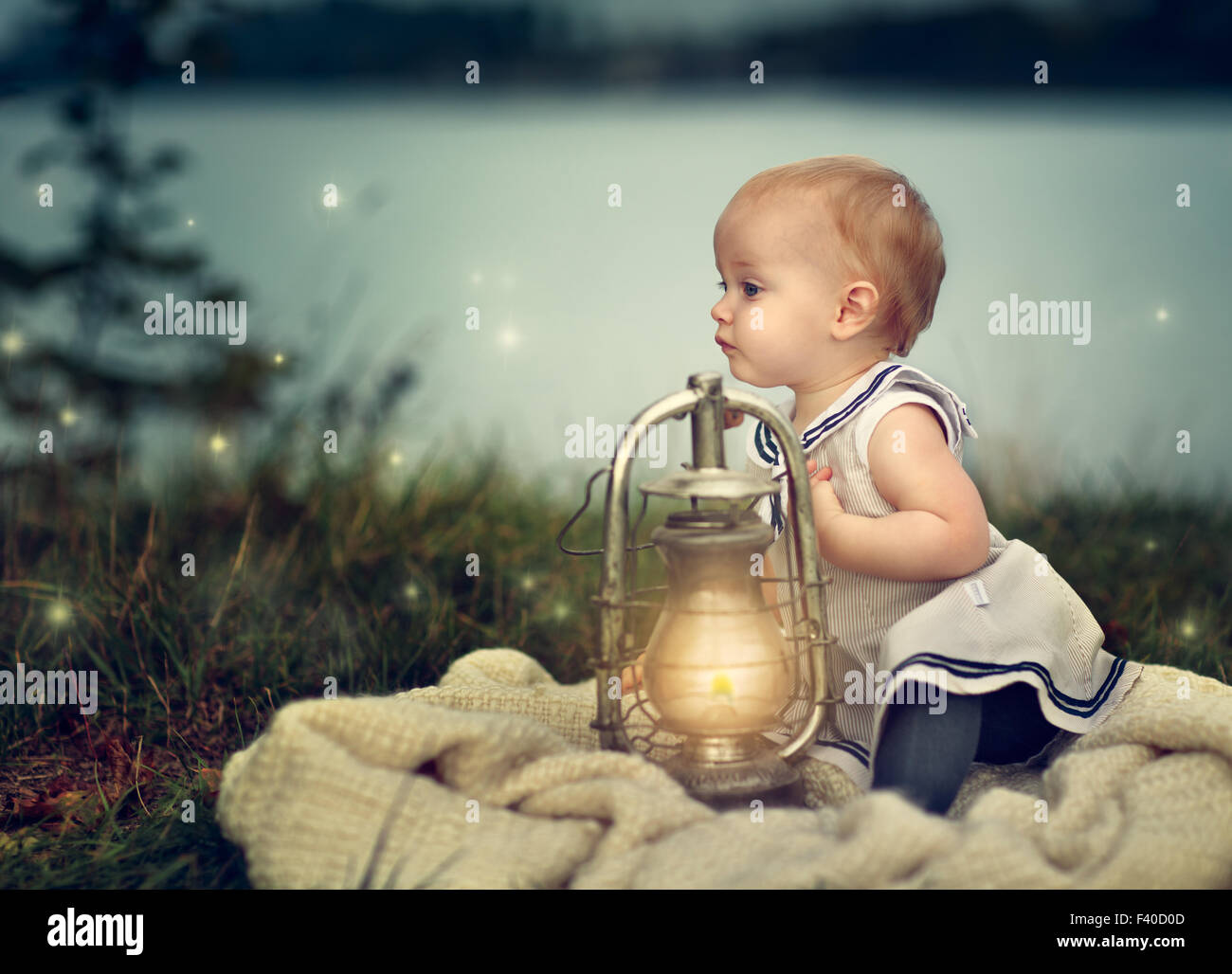 Baby with Lantern Stock Photo