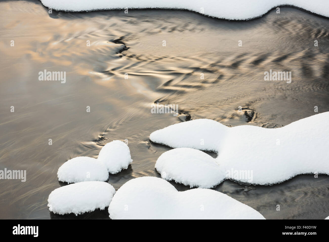 snow covered stones, Lapland, Sweden Stock Photo