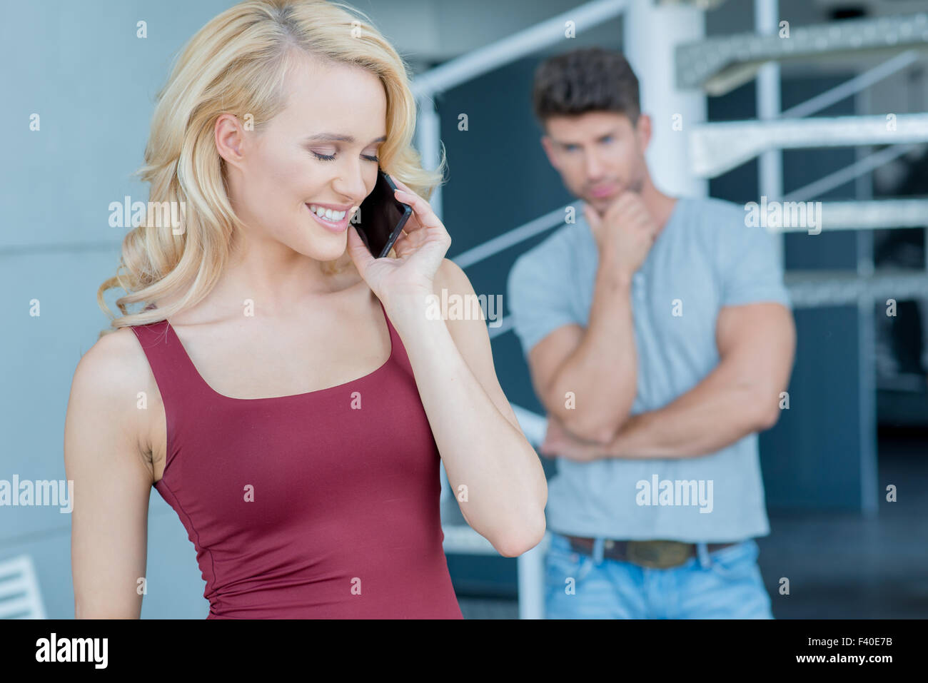 Attractive woman chatting animatedly on her mobile Stock Photo