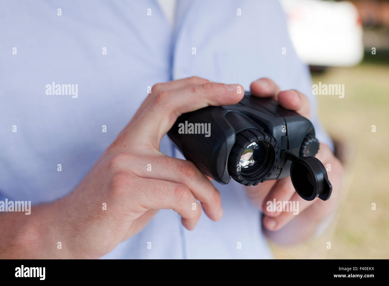 Man holding a Monocular Night Vision Device (MNVD) - USA Stock Photo