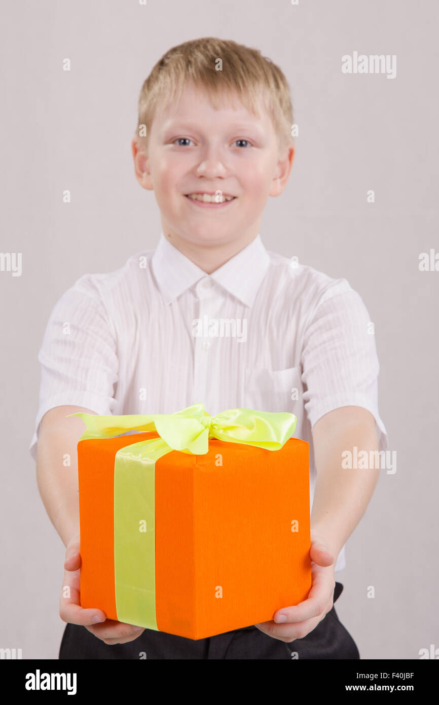 Boy gives gift Stock Photo Alamy