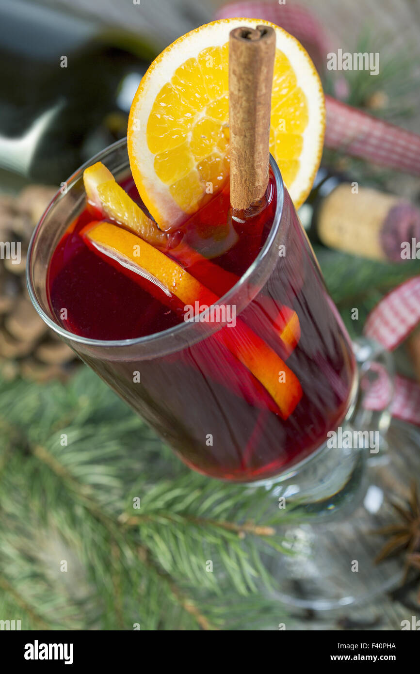 Hot drink of wine, spices and fruits. Stock Photo