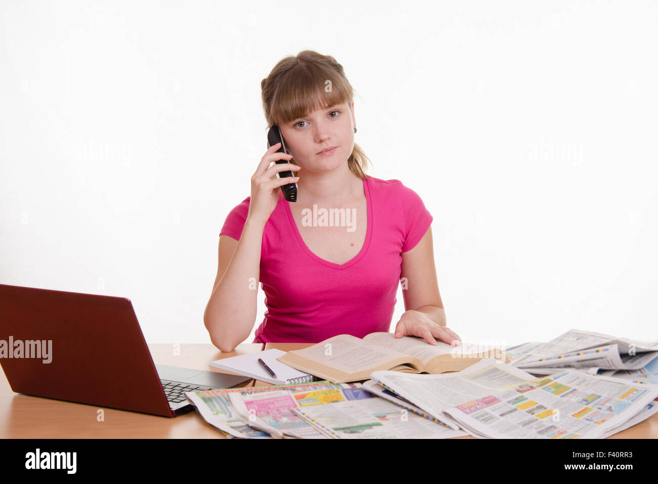 Upset girl calls employer Stock Photo