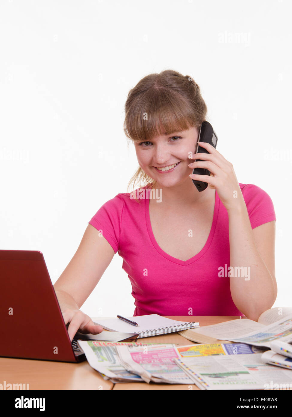 Girl talking on the phone with employer Stock Photo