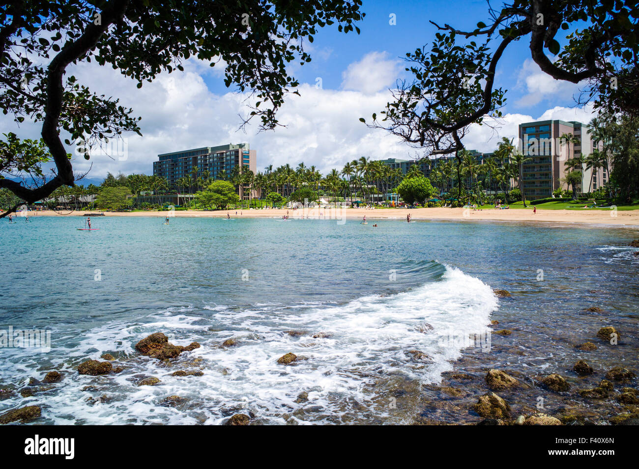 Tourists enjoy the beach and water, Kaua’i Marriott Resort; Kalapaki