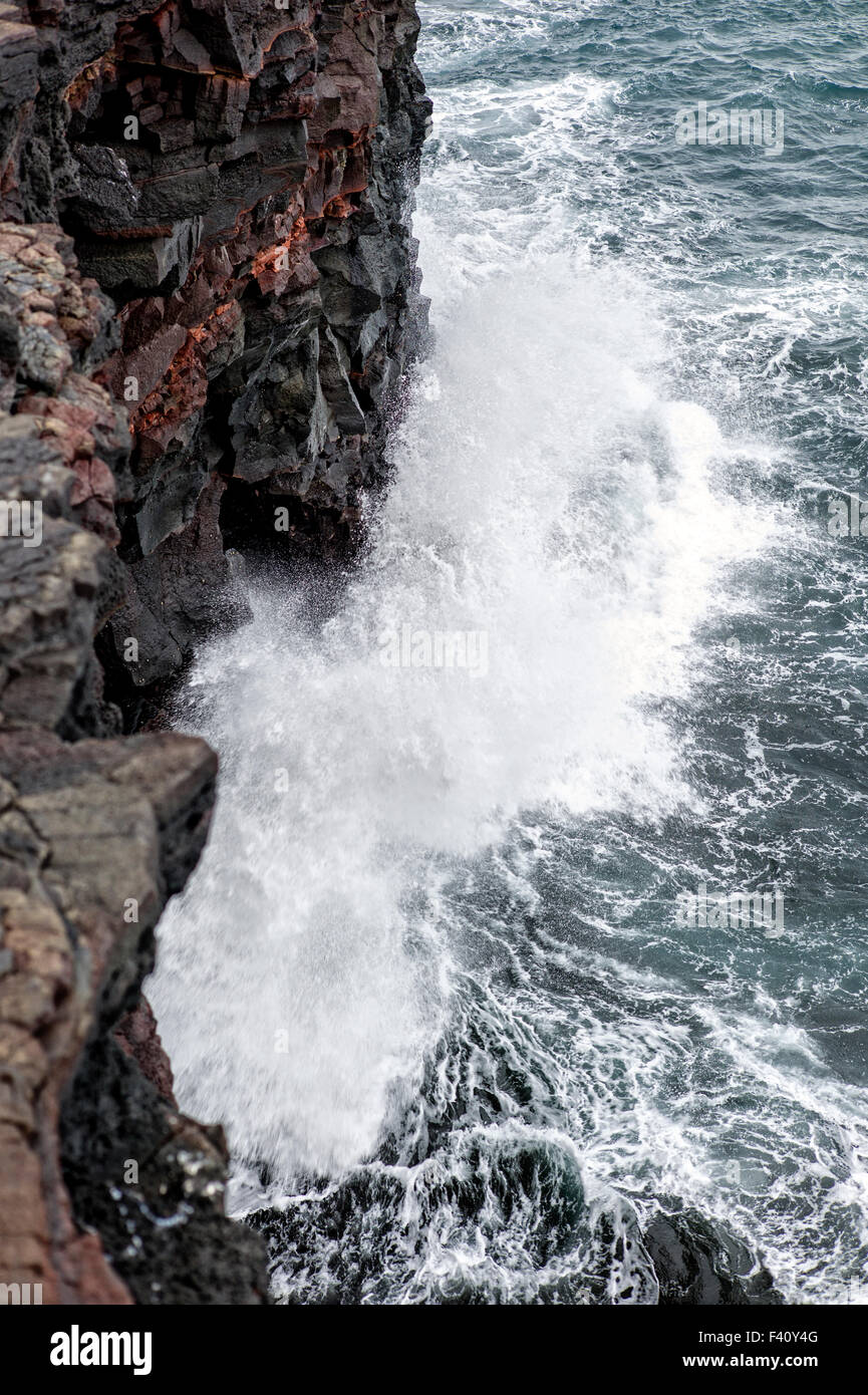 Pacific Ocean waves crash against volcanic rock, Hawai'i Volcanoes National Park, Big Island, Hawai'i, USA Stock Photo