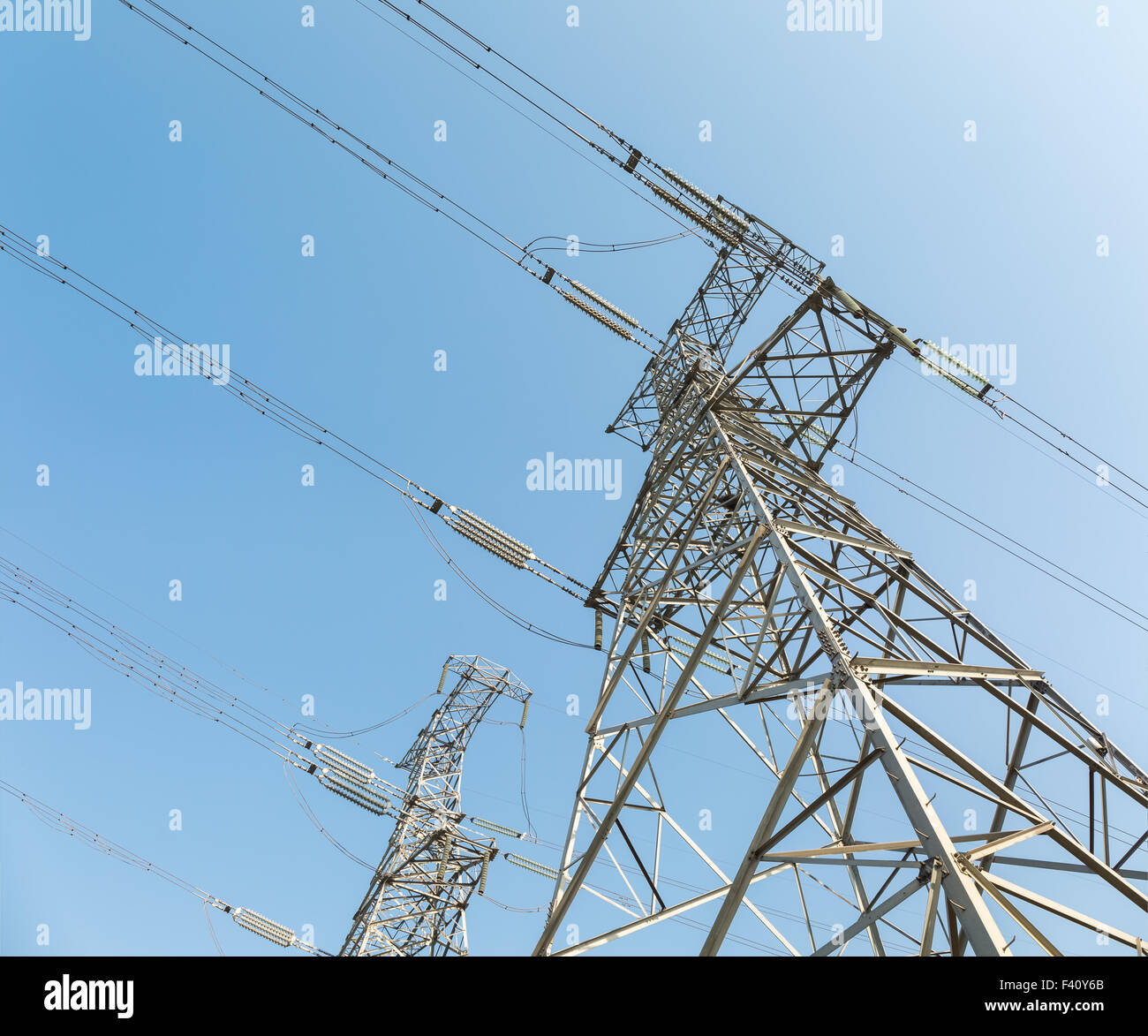 power transmission tower over blue sky Stock Photo