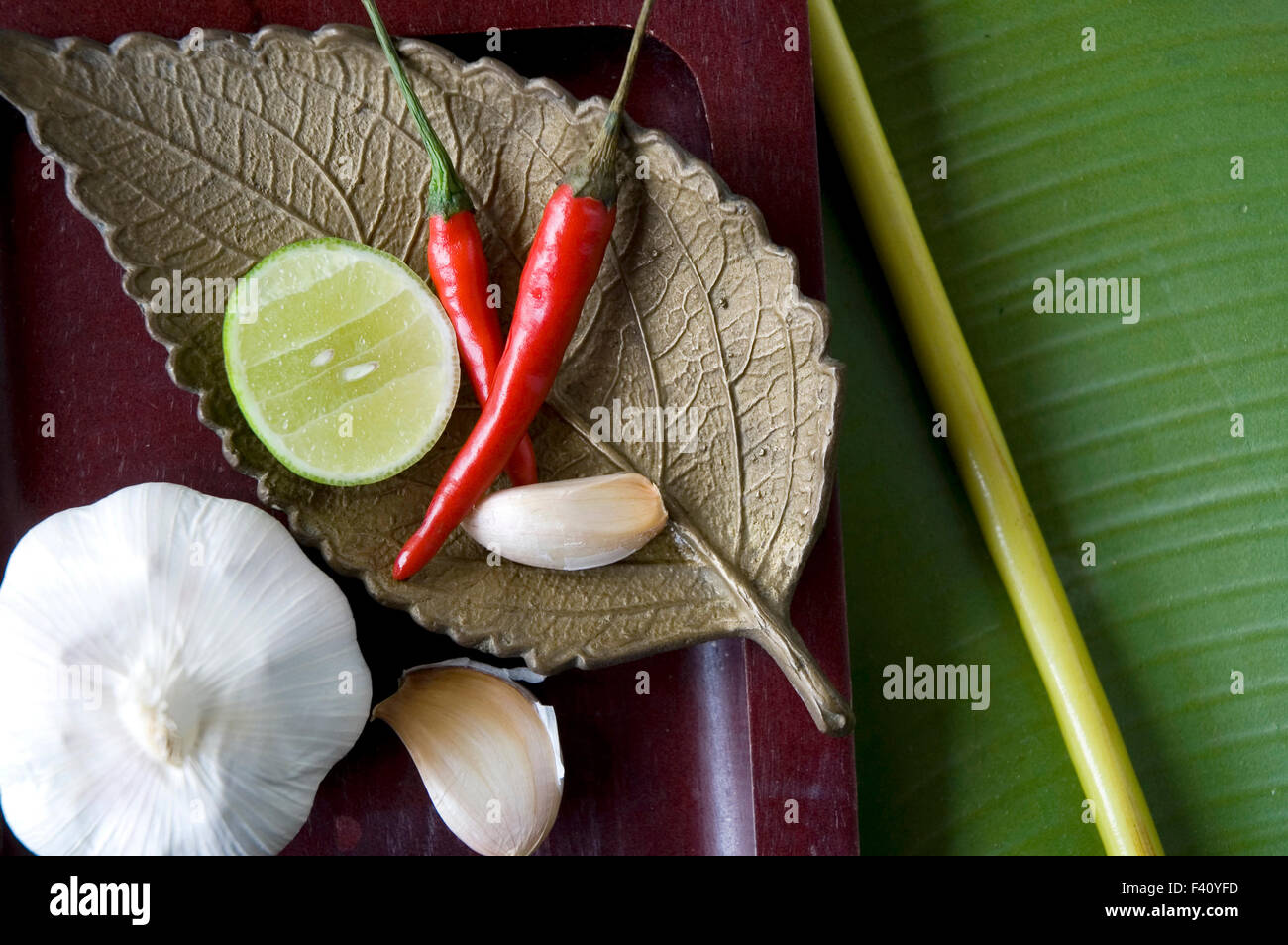 close up spices on golden leaf tray Stock Photo