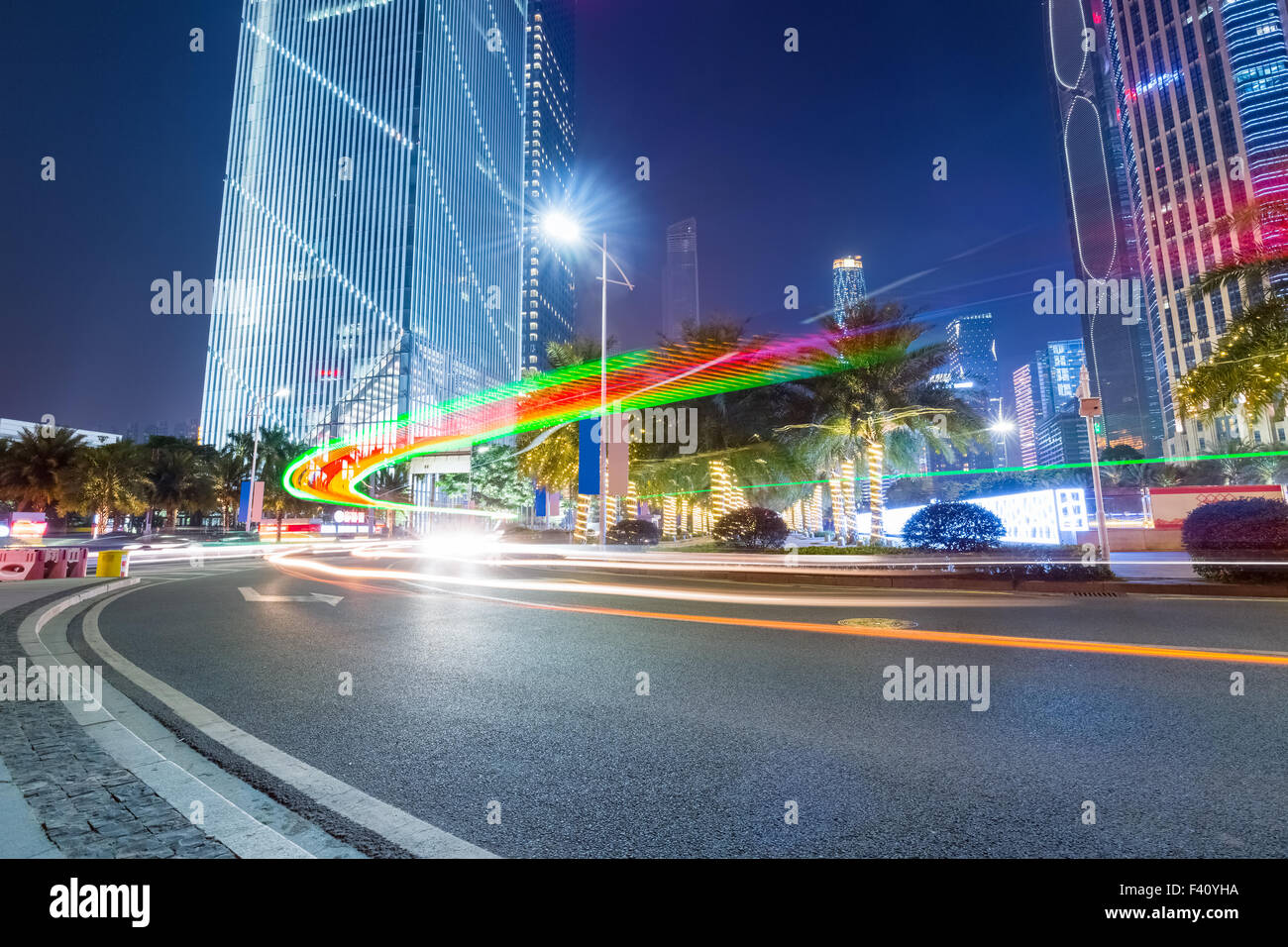 night scene of road with modern buildings Stock Photo