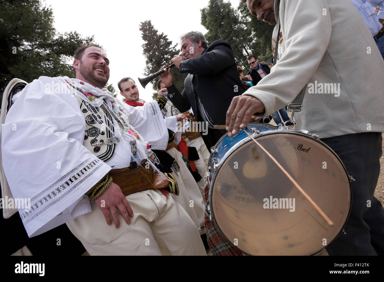Gypsy musicians play the zurna and davul while vlachs enjoy Lent's Koulouma feast and Vlach wedding ritual revival in Thebes, GR Stock Photo