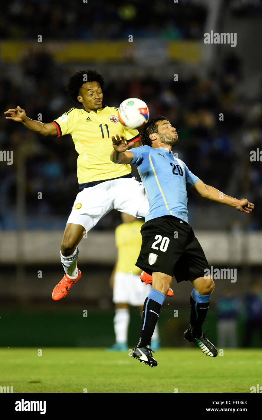 Montevideo, Uruguay. 13th Oct, 2015. Alvaro Gonzalez(R) of Uruguay vies with Cuadrado of Colombia during their Round 1 Group 1 match of 2018 World Cup South American Qualifiers at the Centenario stadium in Montevideo, capital of Uruguay, on Oct. 13, 2015. Uruguay won 3-0. Credit:  Nicolas Celaya/Xinhua/Alamy Live News Stock Photo