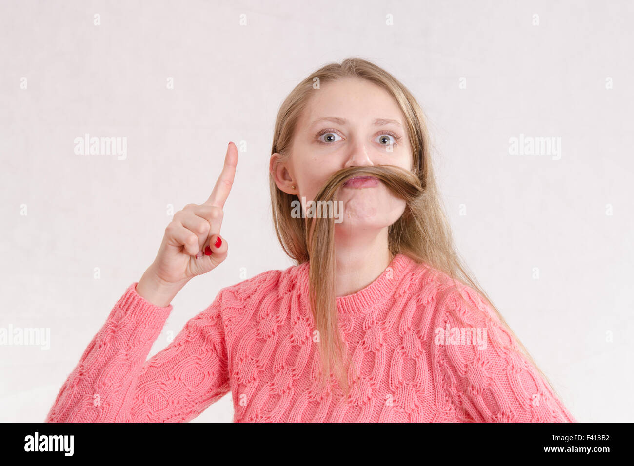 Cheerful girl strikes gangsters Stock Photo