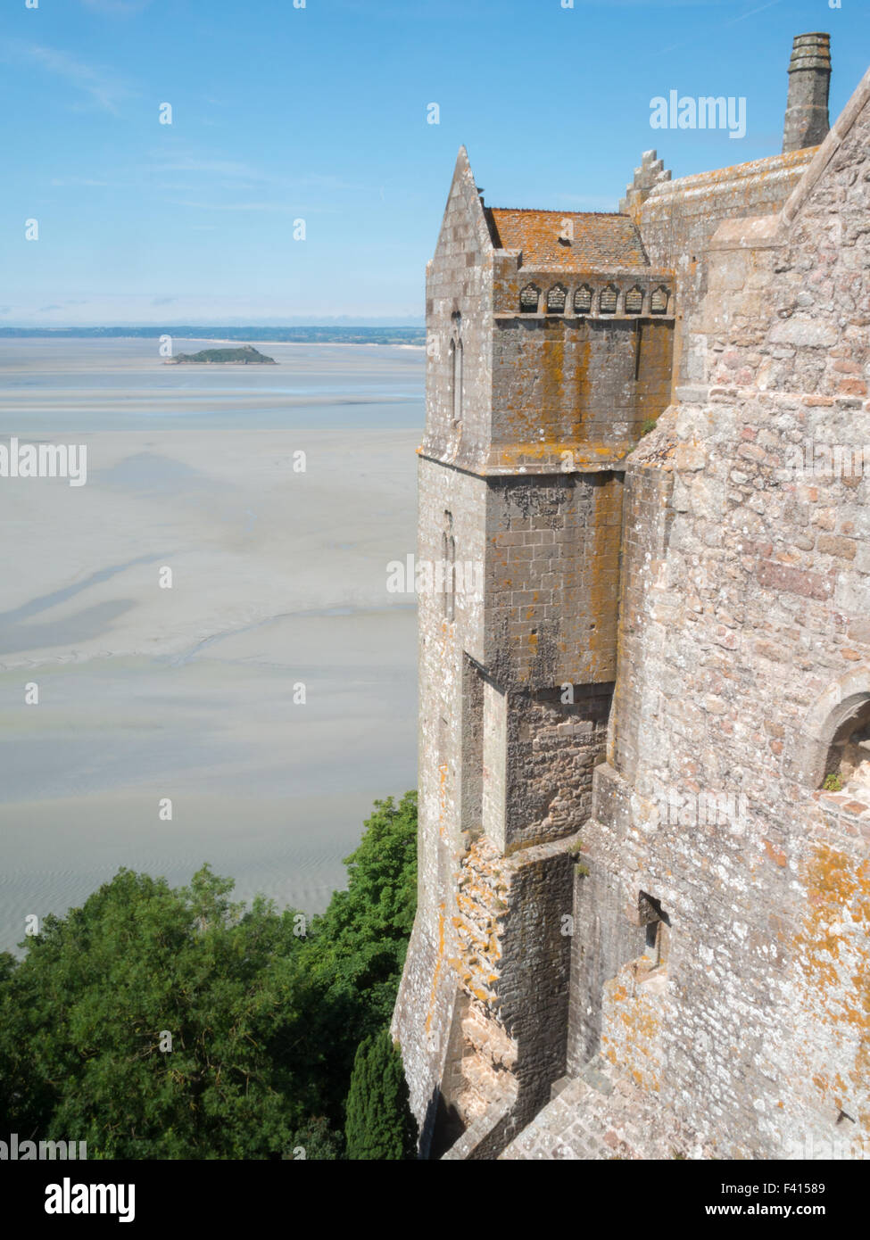 View of the wall of Mont Saint-Michel with low tide in backgrounf Stock Photo
