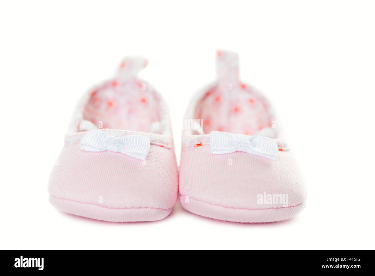 Pink baby sneakers closeup isolated Stock Photo Alamy