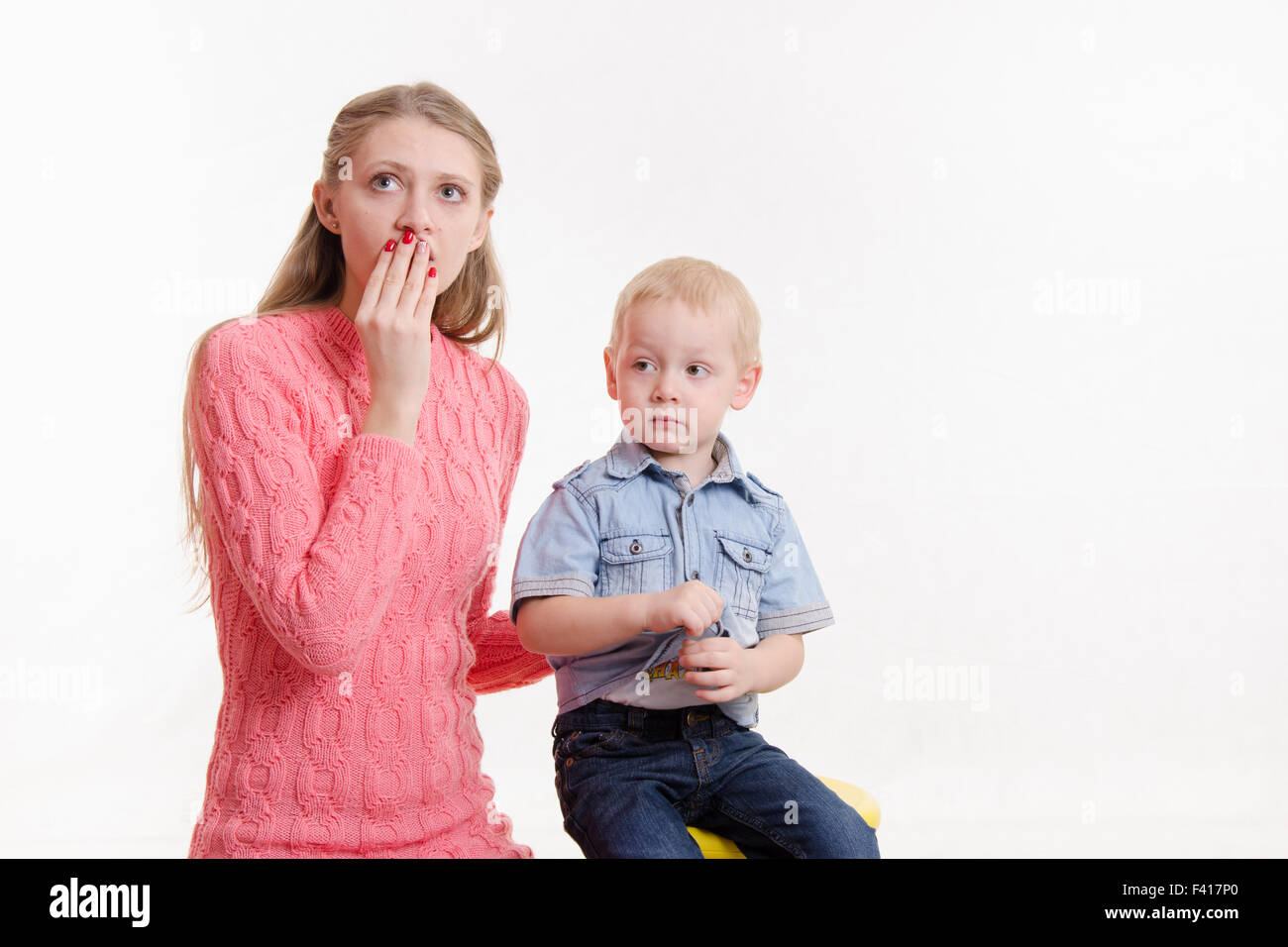Young mother is shocked by three sons Stock Photo