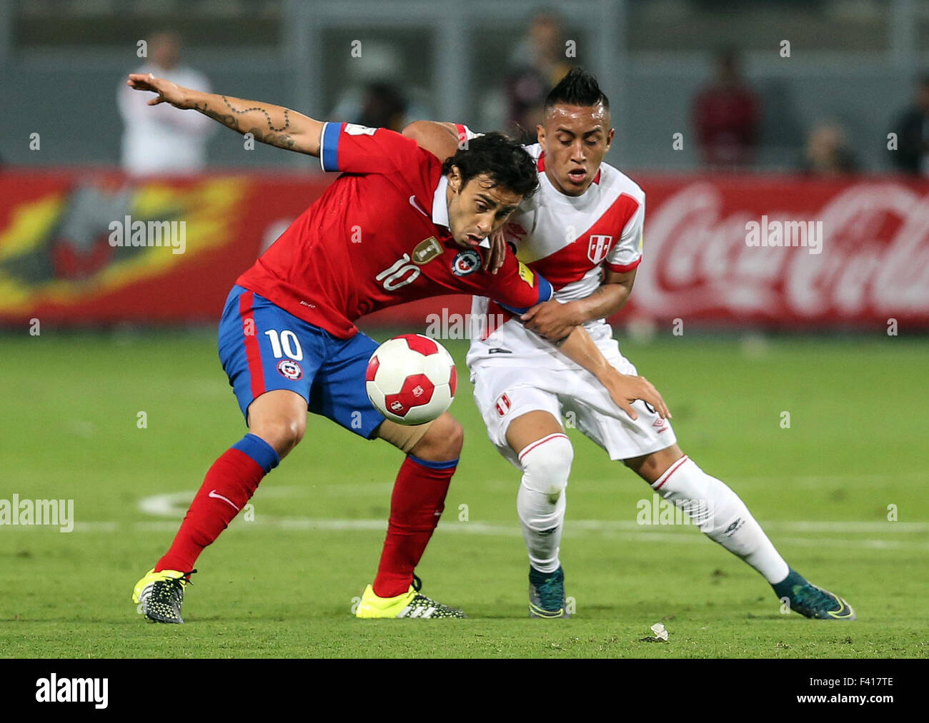 Lima. 13th Oct, 2015. Jorge Valdivia(L) of Chile vies with Christian Cueva of Peru during their Round 1 Group 1 match of 2018 World Cup South American Qualifiers at the National Stadium in Lima, Peru on Oct. 13, 2015. Chile won 4-3. Credit:  ANFP/Xinhua/Alamy Live News Stock Photo
