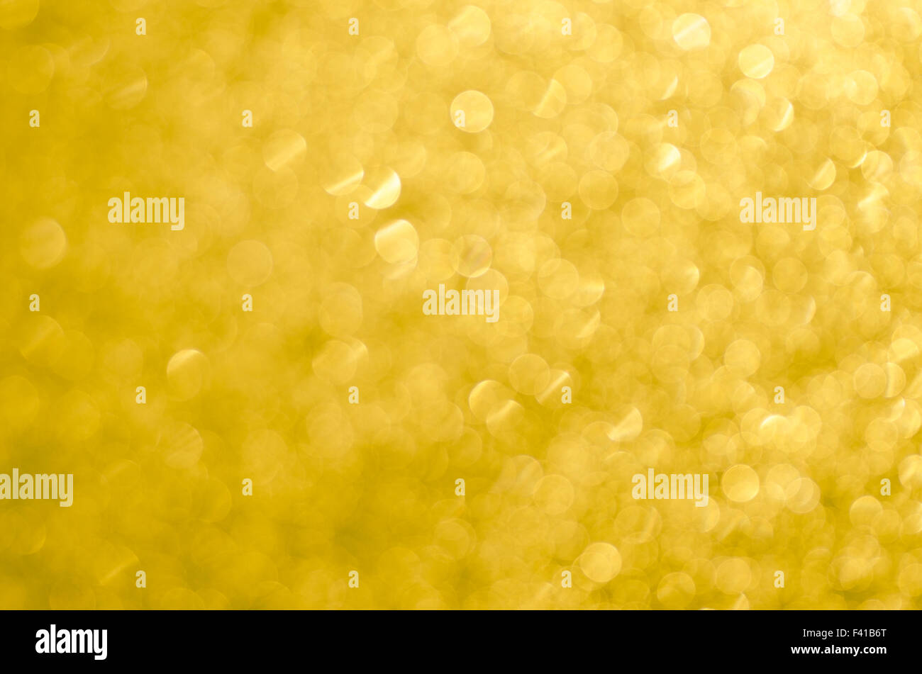 golden abstract blurred bokeh lights background Stock Photo - Alamy