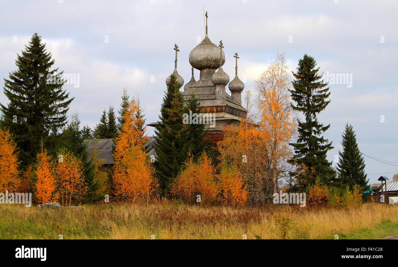 Ancient Russian Church in the autumn forest Stock Photo