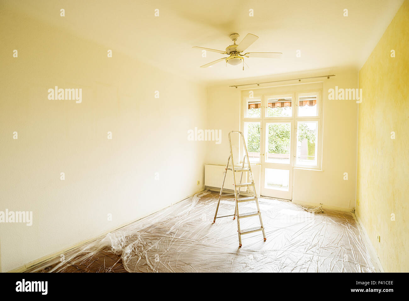 ladder in empty room Stock Photo