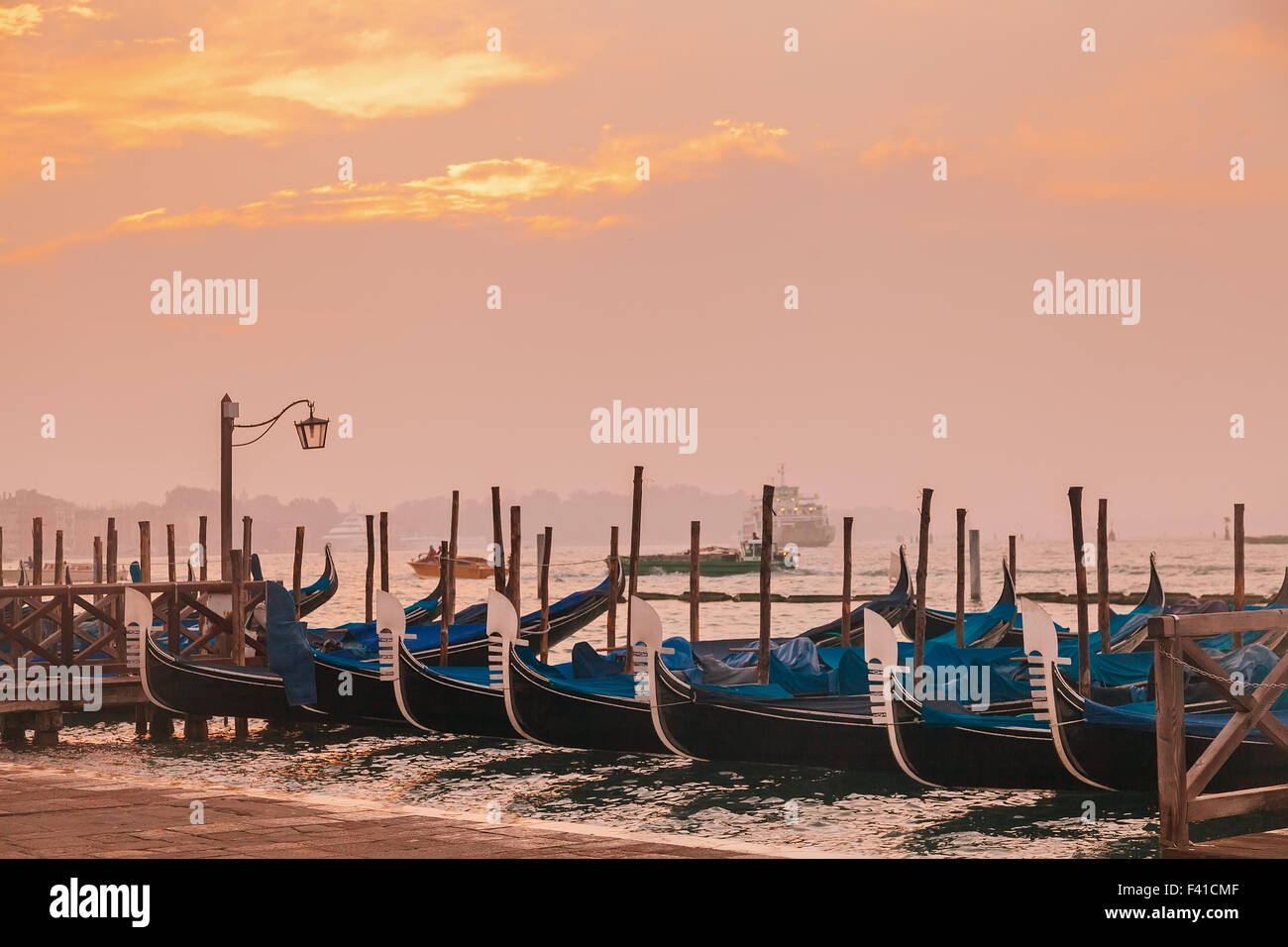 Venetian gondolas at sunrise in venice Stock Photo - Alamy